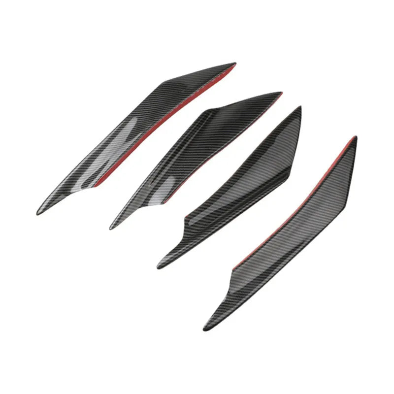 Set of four black ABS plastic bumper blade spoilers for car modification on a white background.