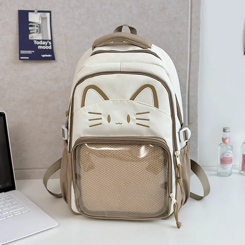 Korean cartoon large capacity nylon backpack in pink colour with badge pendant.