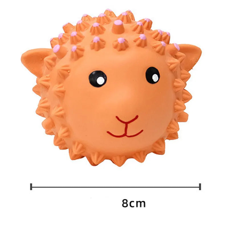 Orange and yellow latex squeaky dog toy with spiky texture for teeth cleaning, shown next to a measuring tape indicating 3-inch diameter.