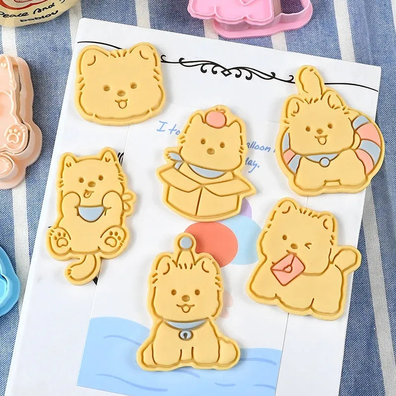 3D plastic biscuit mould with cartoon dog shapes including puppy head and birthday hat