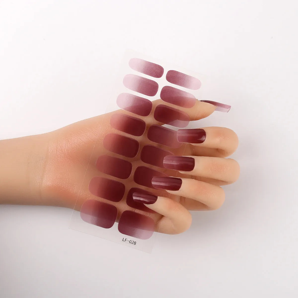 Sheet of 16 solid colour nail art sticker designs including cross, rose, and leopard print patterns.