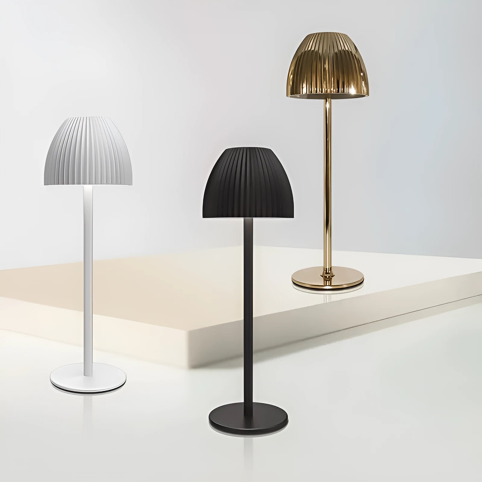 Modern small night lamp with thin round base in black or white, featuring dimming controls