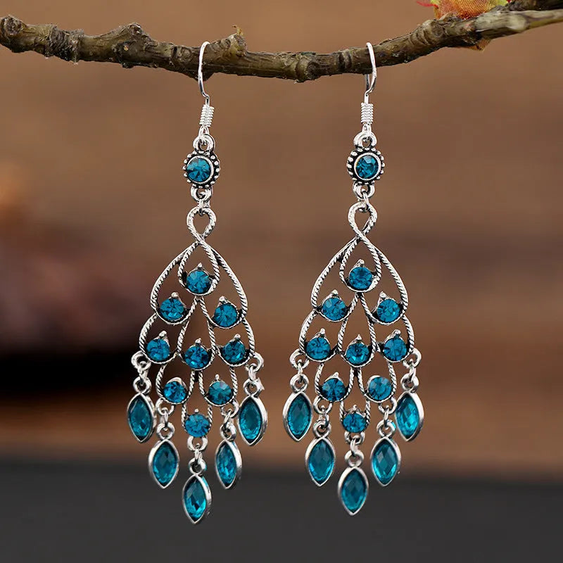 Purple retro drop earrings with dangling crystal fringe elements and ethnic style detailing
