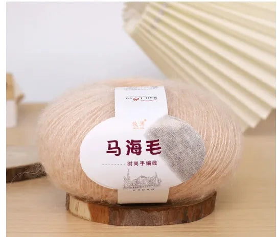 Single ball of mohair yarn in various colours for hand-woven DIY scarf knitting projects