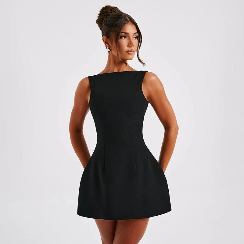 A woman wearing a slim-fitting black backless sleeveless summer dress with a high waist and short skirt.