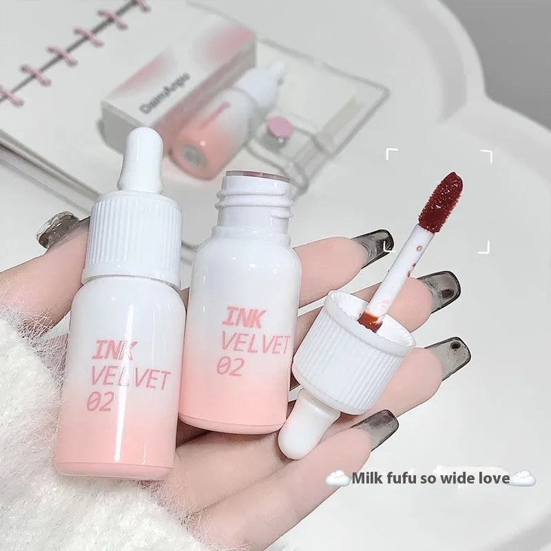 Mirror Lip Lacquer tube in the Milk Huhoo series, showing one of four available shades with 3.5g net content.