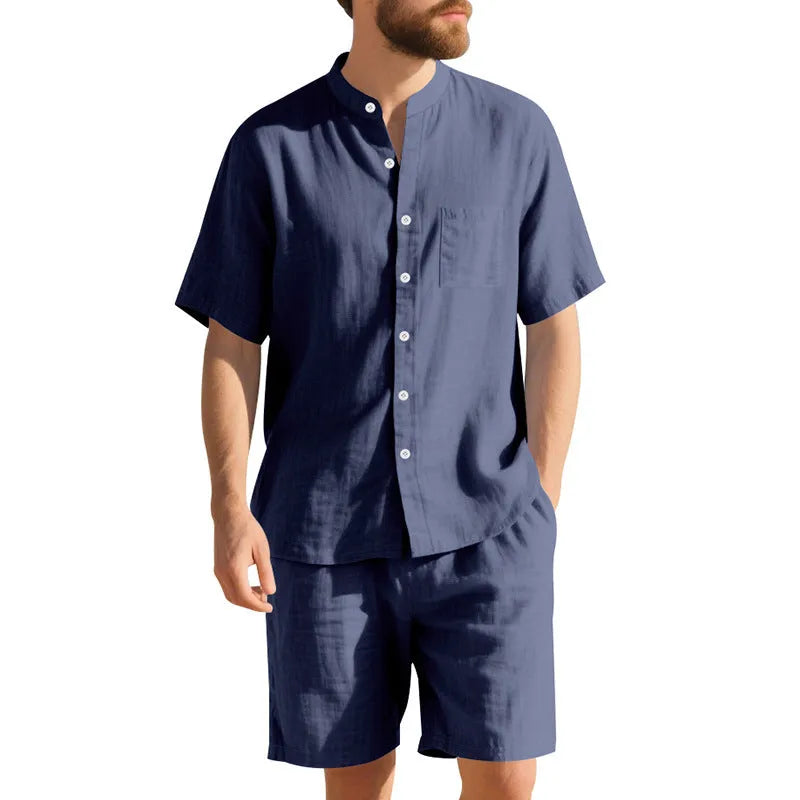 Man wearing a light blue linen blend short sleeve shirt and matching shorts, a casual summer two-piece suit.