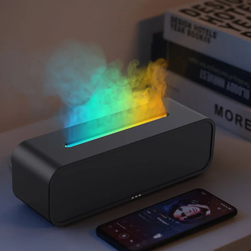 Black and white aroma diffuser with dynamic flame LED light effect on a table.