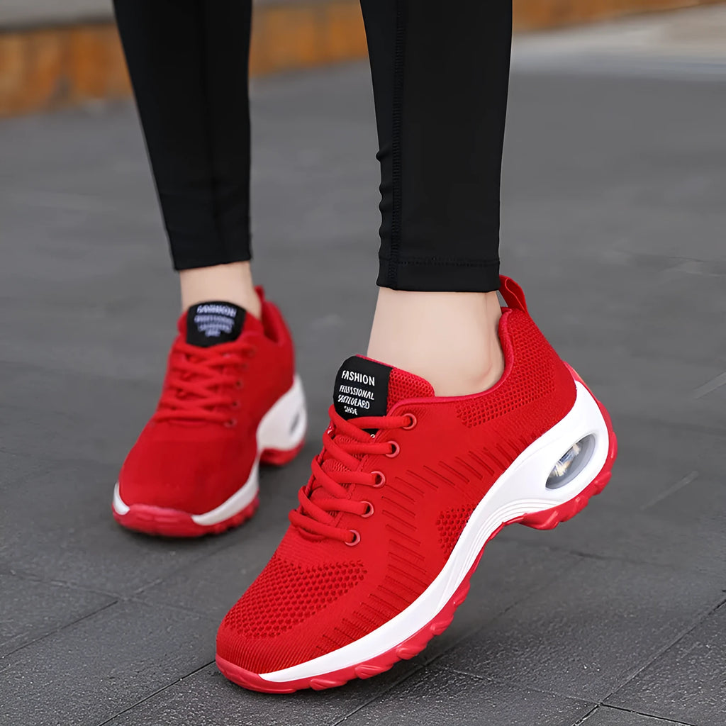 Women's red and black mesh low top sneakers with front lace-up and round toe design