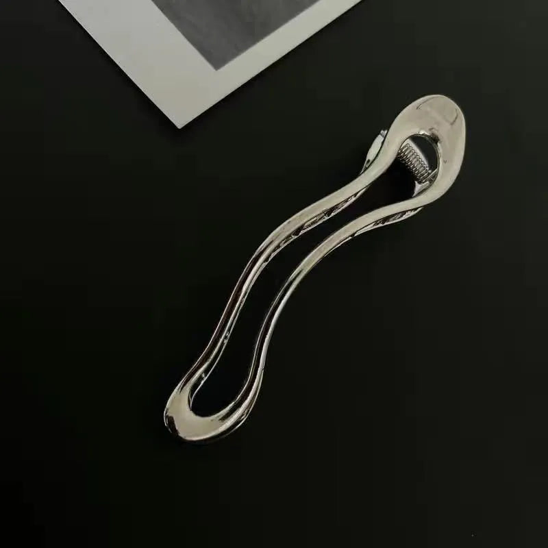 Women's zinc alloy hair barrettes in gold and silver with square, arc and triangle shapes
