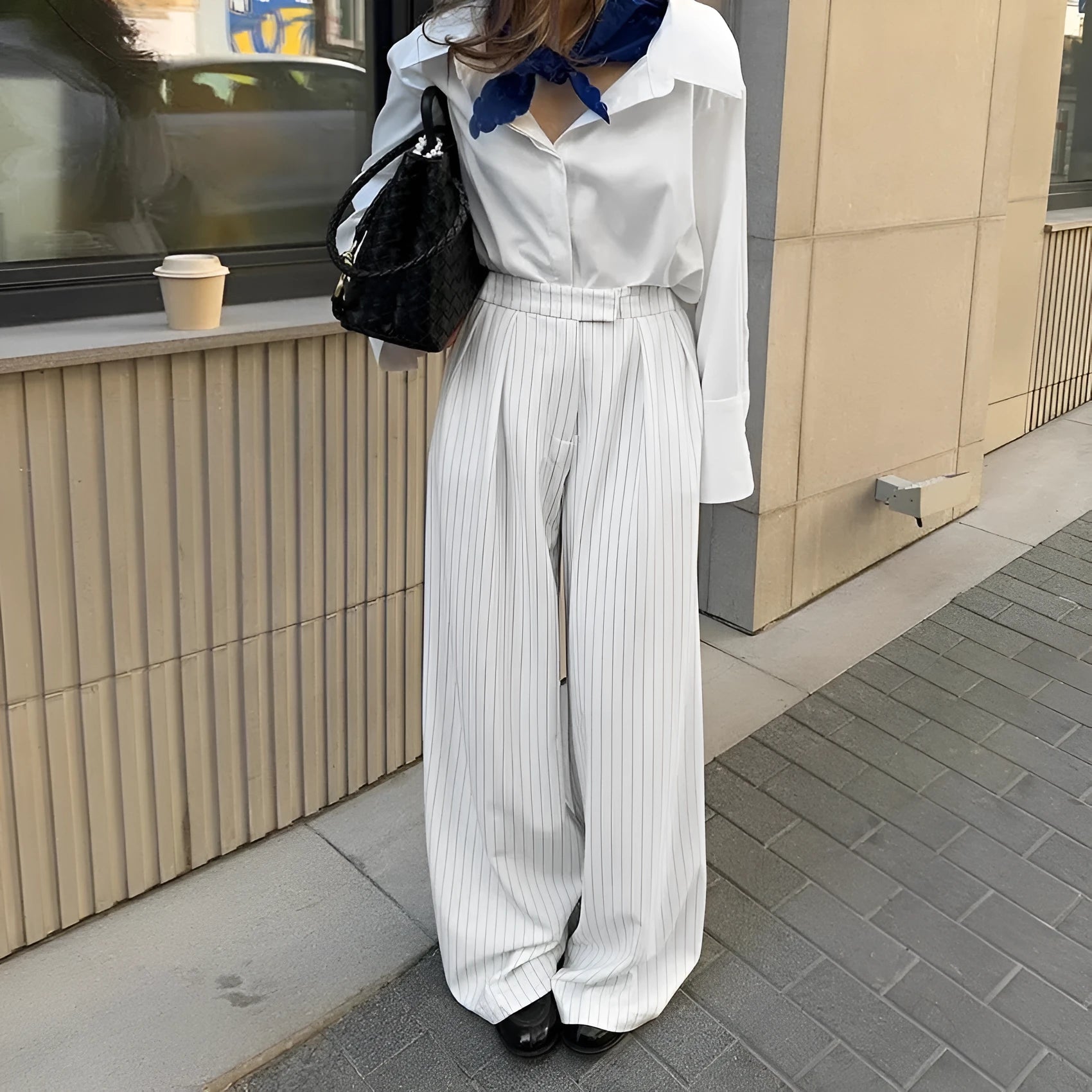 White wide-leg trousers with vertical stripes, loose casual fit, zipper detail, suitable for commuting and office wear