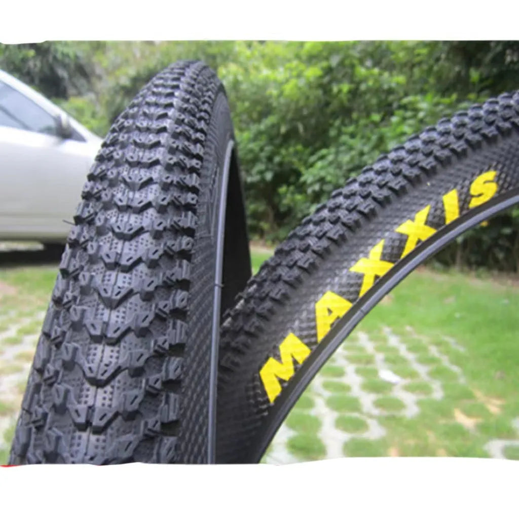 Ultralight puncture resistant mountain bike tyre shown in multiple sizes including 26, 27.5, and 29 inch diameters.