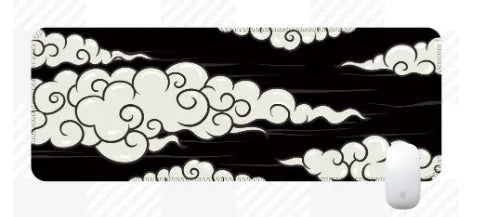 Large natural rubber desk mat with Japanese cloud pattern on a wooden desk, showing non-slip base.