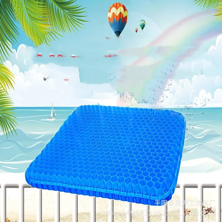 Grey honeycomb gel seat cushion with removable cover, shown on a wooden chair.