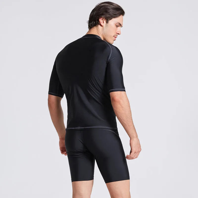 Men's quick-drying half sleeve swim suit with separate swim top and pants in navy blue.