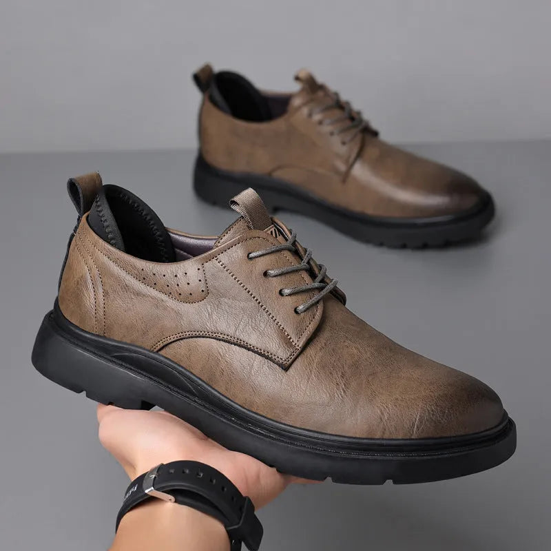 Men's black and brown leather casual sneaker with rubber sole and decorative sewing line detailing
