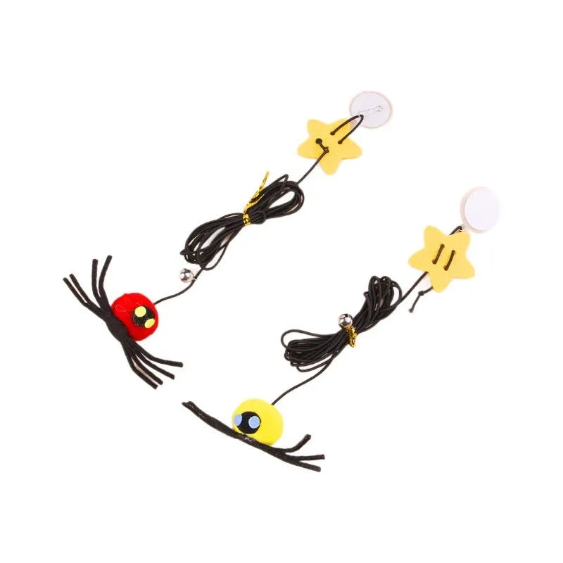 Cat door hanging toy with elastic rope, feather, bell, and spider design in red colour