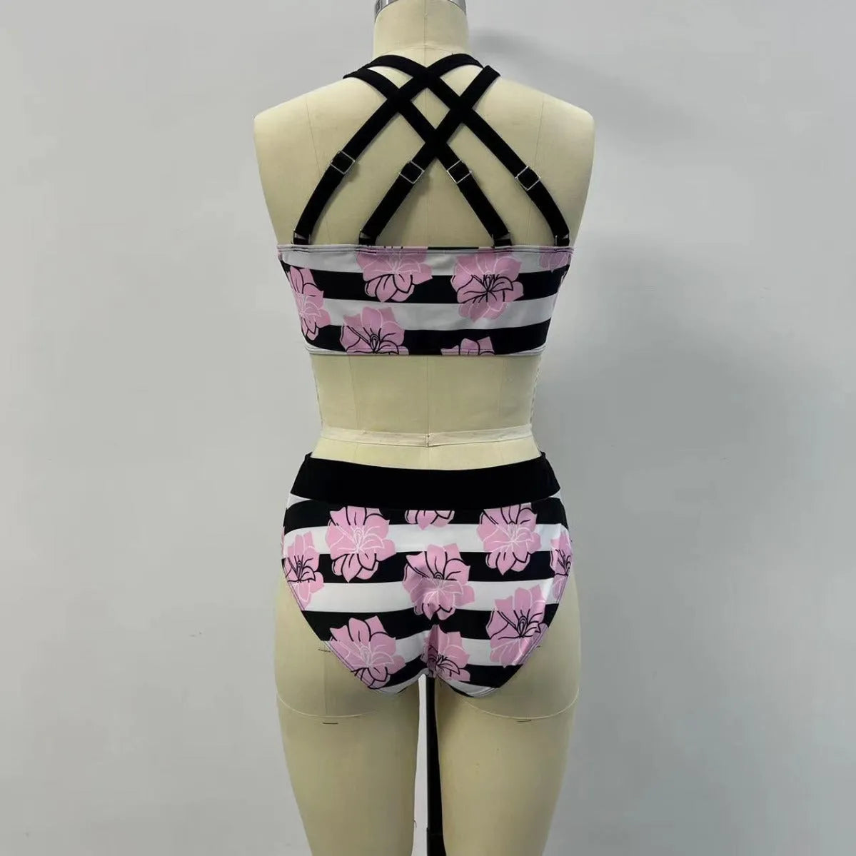Black women's printed split bikini with high-waisted brief for belly coverage.