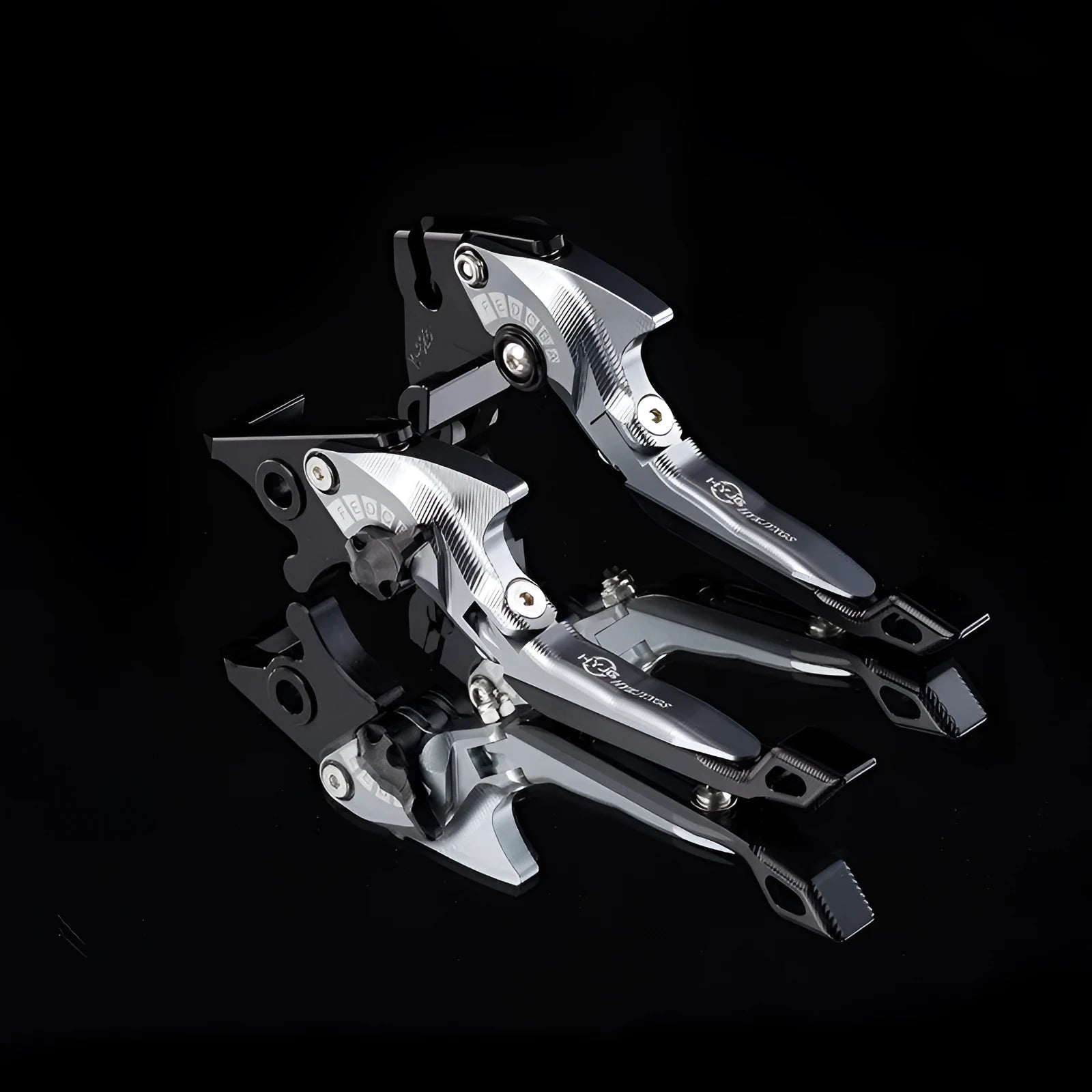 Pair of anodised metal motorcycle brake and clutch levers with adjustable length mechanism