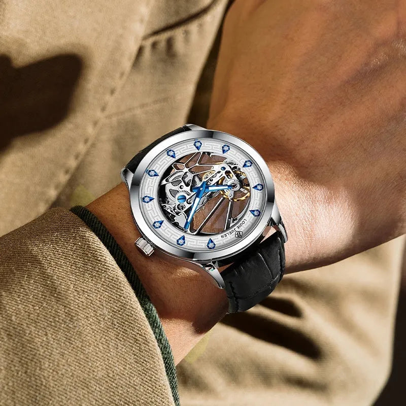 Men's silver case mechanical watch with white dial, blue luminous hands, and black leather strap.