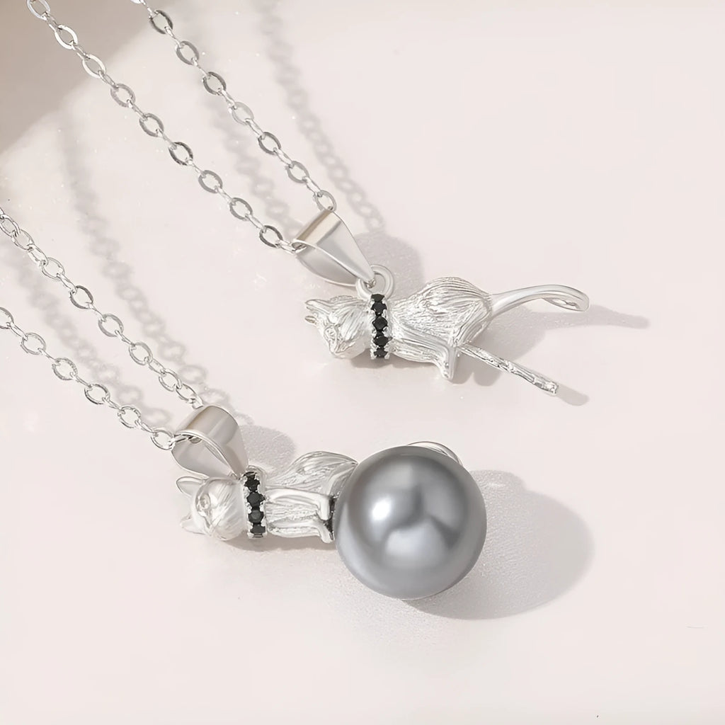 Close-up of a sterling silver cat pendant on a chain, showing the D2113 or D2114 finish variant.