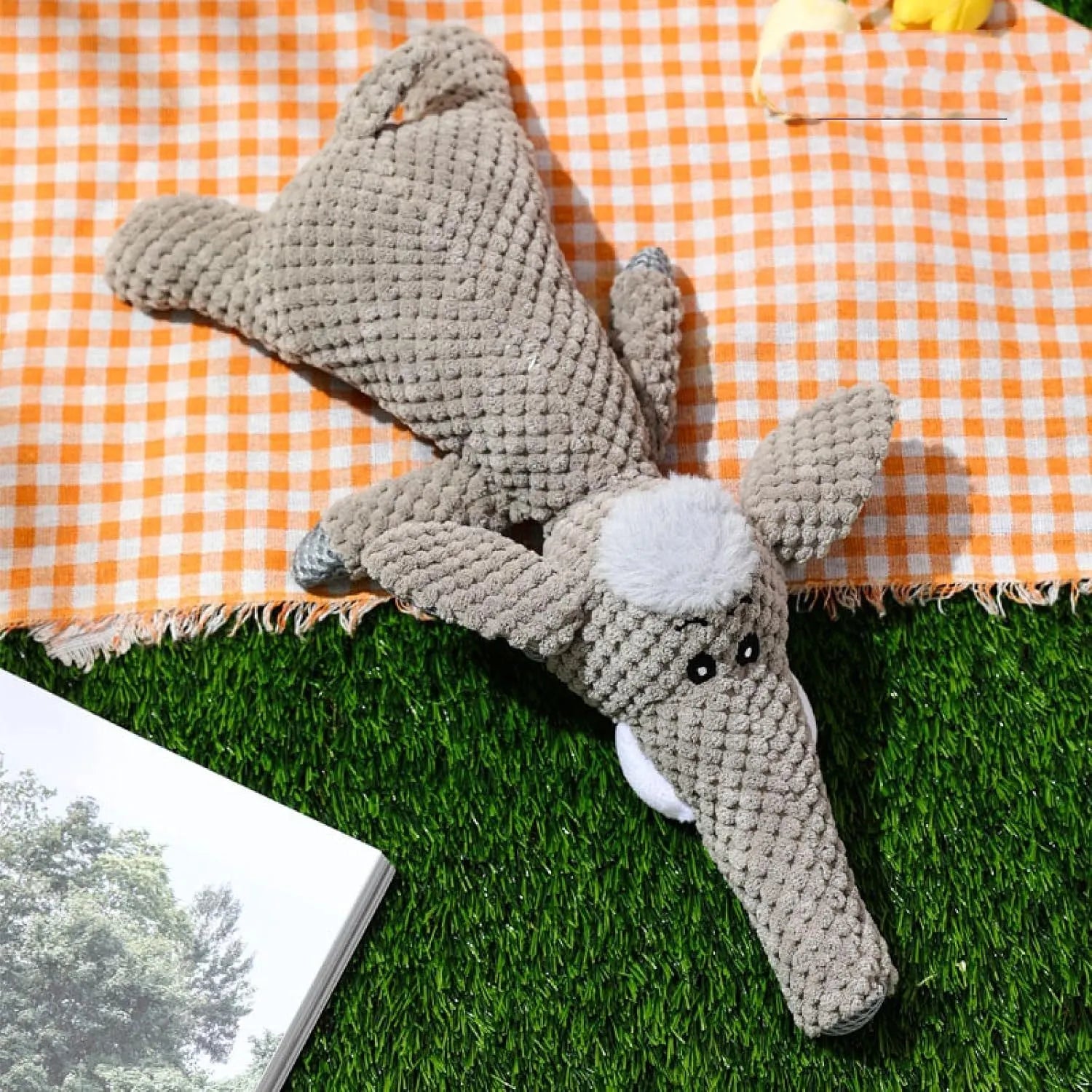 Plush dog toy with corn kernel texture in green grey or yellow featuring a built-in sound device for teeth grinding