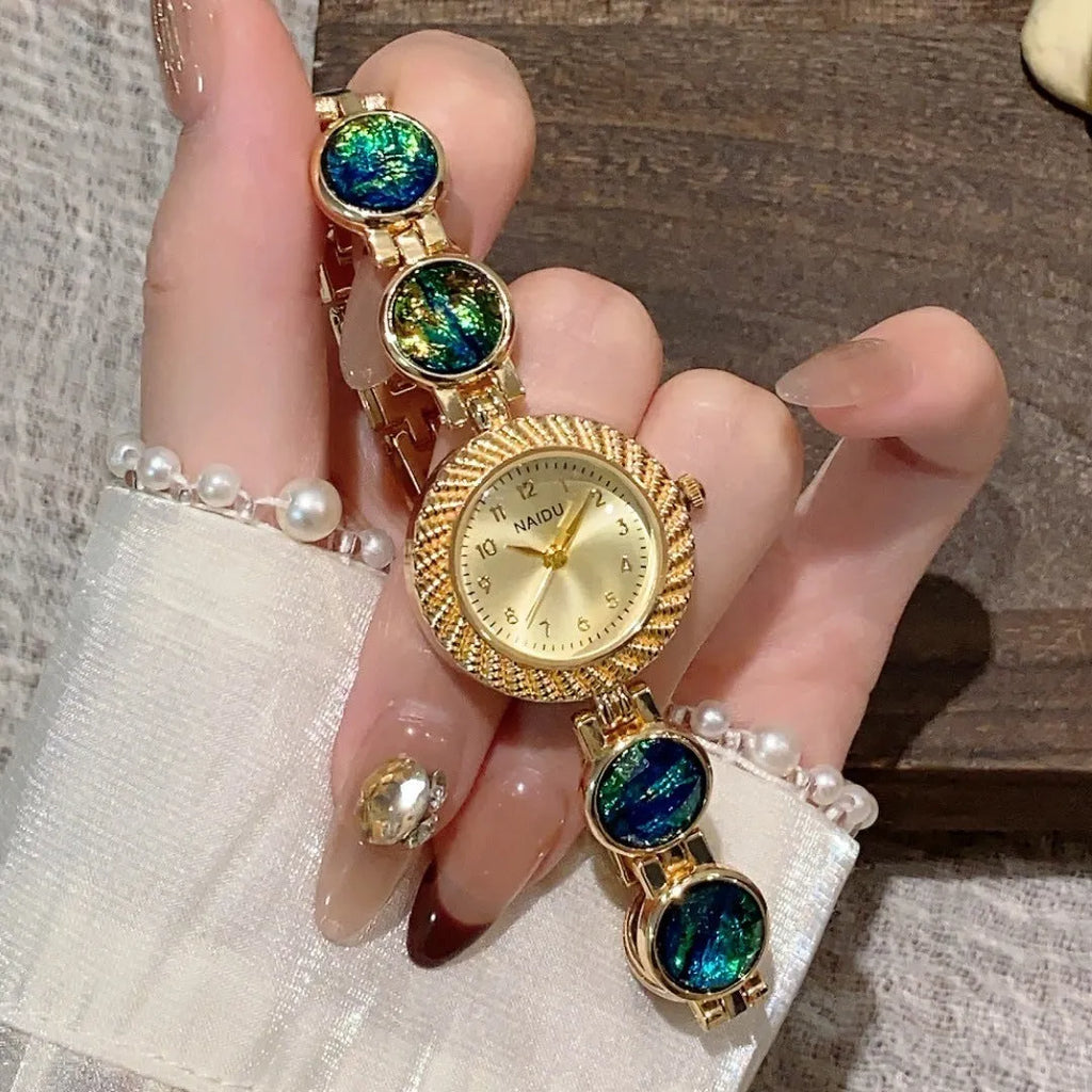 Women's quartz watch with 25mm round dial and zinc alloy case in multiple colour options