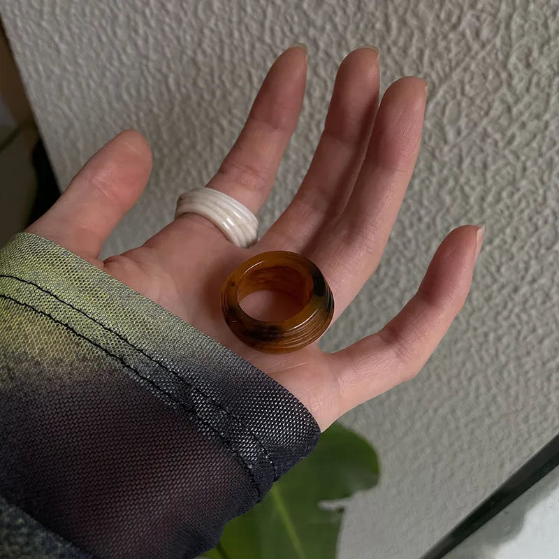 Geometric Chinese style resin ring in brown or white colour with irregular width design