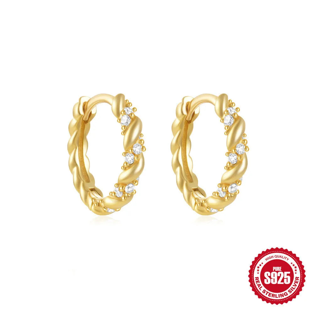 Sterling silver geometric stud earrings with small round diamond detailing in gold and silver electroplated finishes