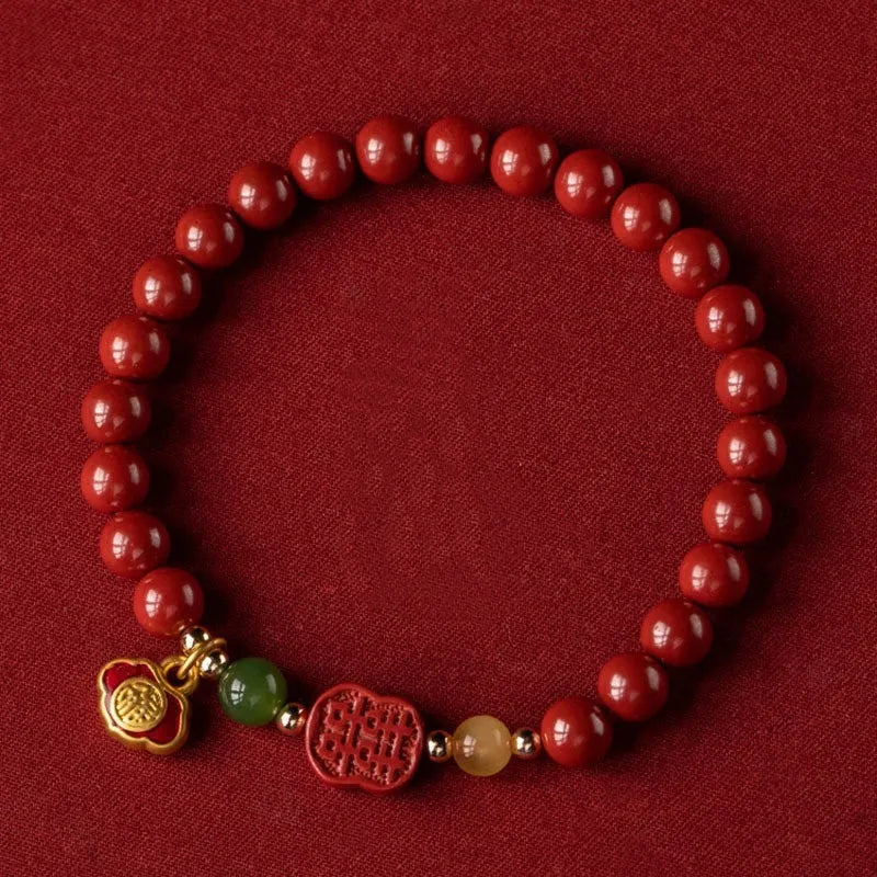 Cinnabar bracelet with raw emperor sandstone beads and a fu character charm in new Chinese style.