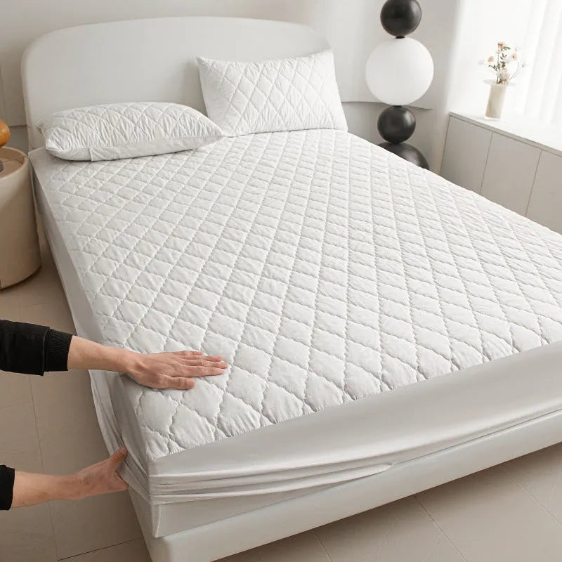 Diamond lattice quilted waterproof mattress protector set with bamboo fibre fitted sheet and pillowcases.