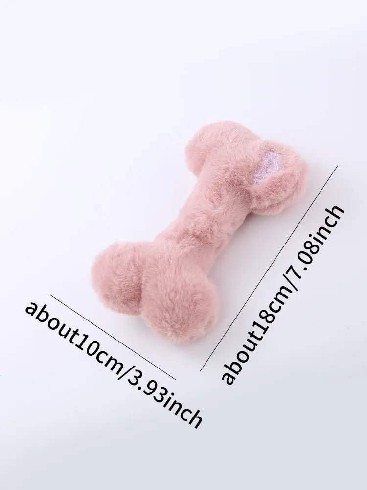 Cute love bone shaped plush dog toy in blue, pink, and yellow colours for interactive chewing play.