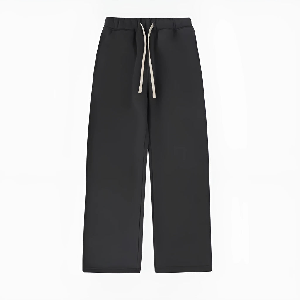 Men's black fleece-lined sweatpants with elastic drawstring waist shown in loose fit