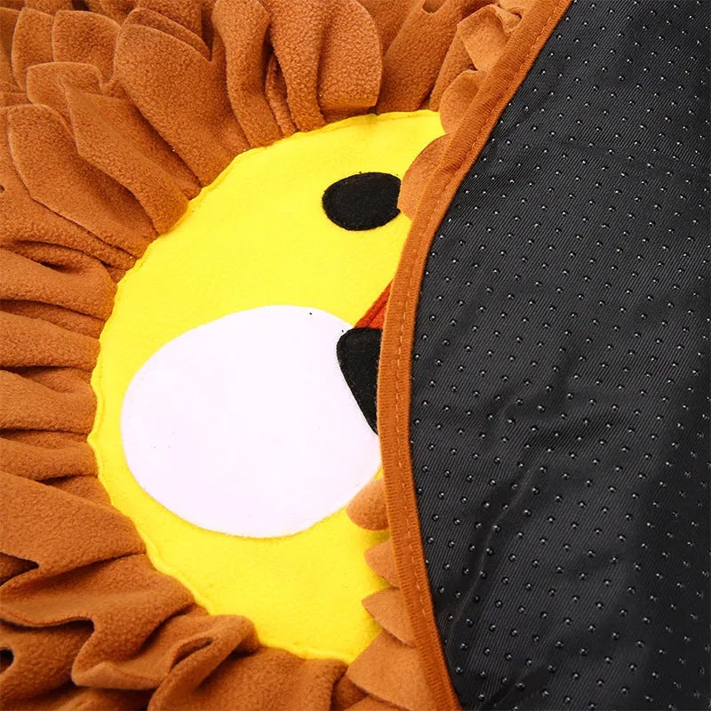 Brown lion face pattern snuffle mat for dogs and cats on a floor.