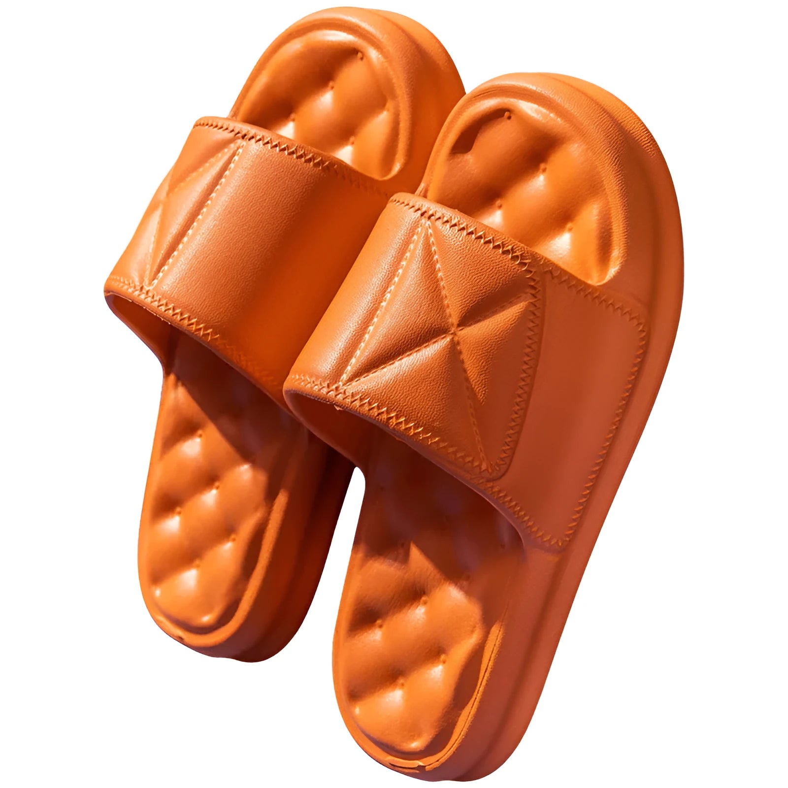 Soft EVA non-slip bathroom slippers with thick sole in assorted colours on a bathroom floor.