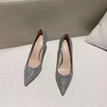 Women's silver and black crystal bridal shoes with stiletto and low heels on a size chart.