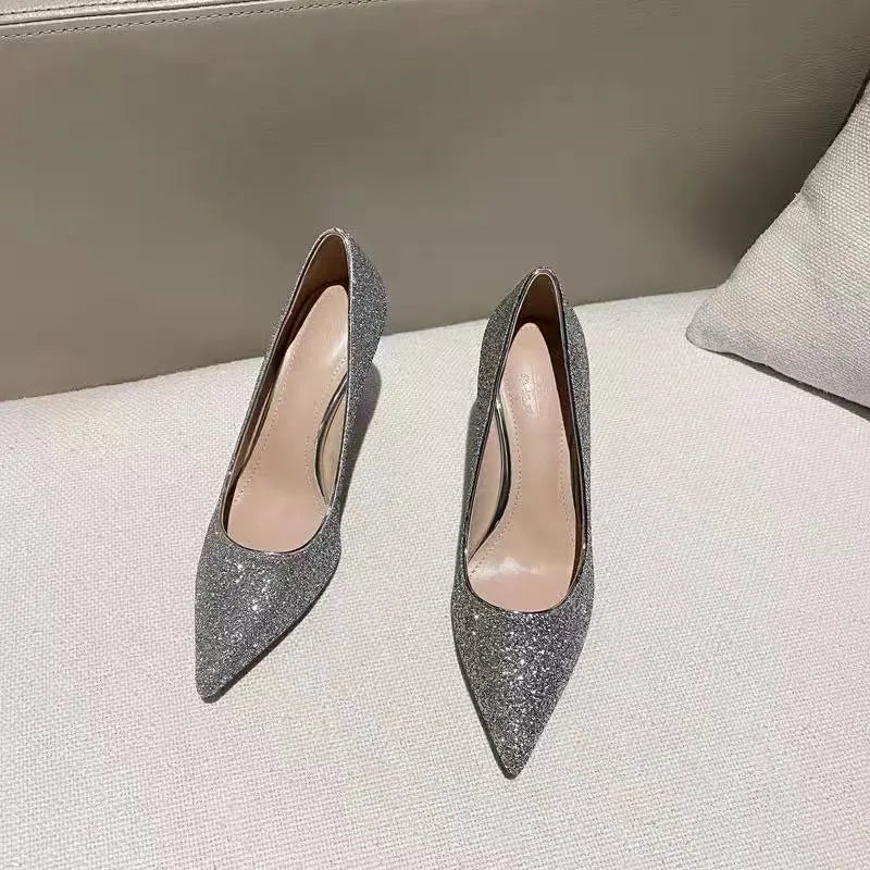 Women's silver and black crystal bridal shoes with stiletto and low heels on a size chart.
