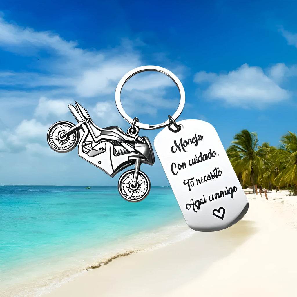 Stainless steel motorcycle keychain on a flannel bag.