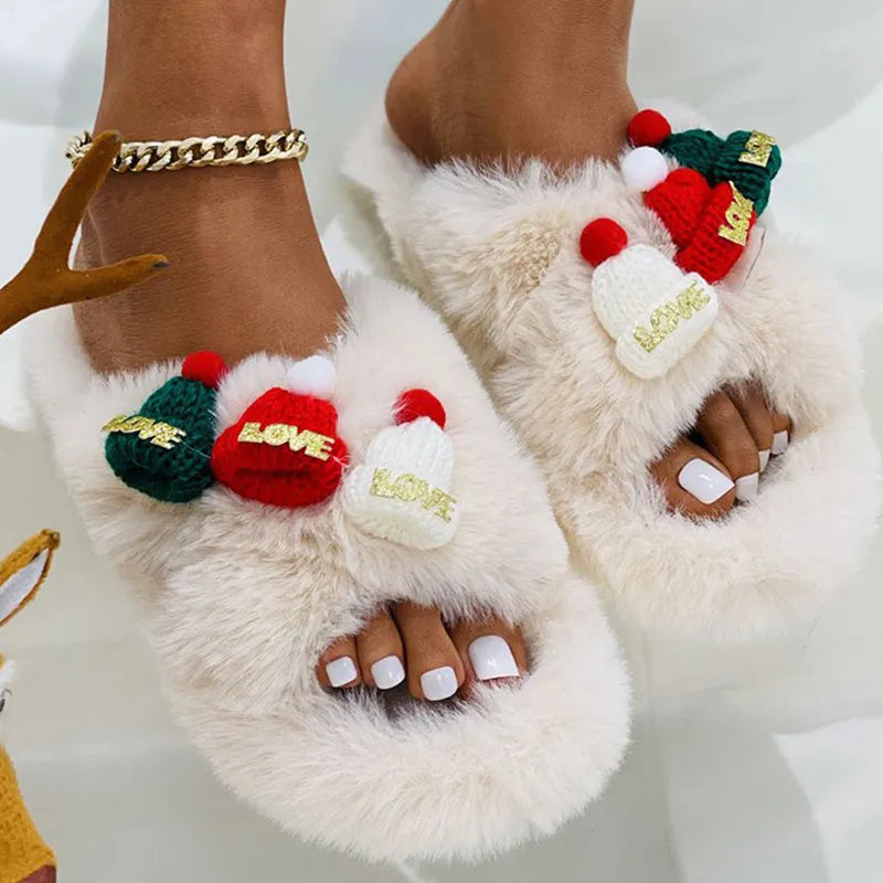 Women's Christmas hat slippers in faux plush with a rubber sole.