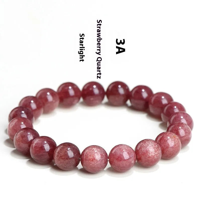 Natural strawberry quartz bracelet with geometry-shaped beads in starlight cherry red colour on a wrist.