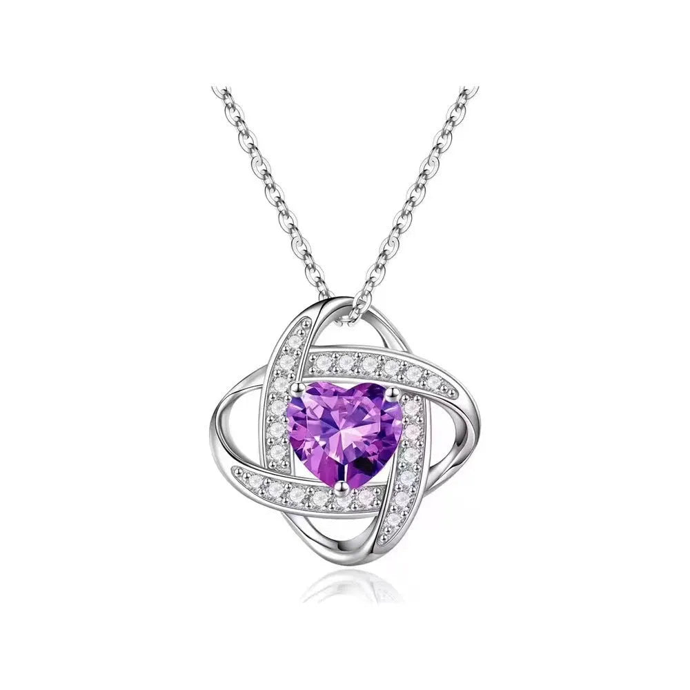 Copper heart necklace with electroplated platinum finish showing multiple colour variations