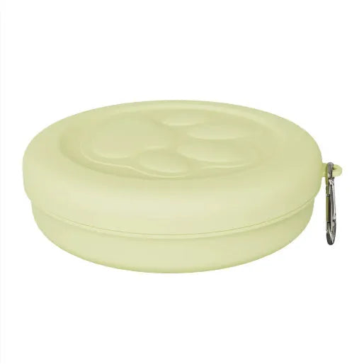 Collapsible silicone dog bowl in light pink and green colours showing portable feeding design