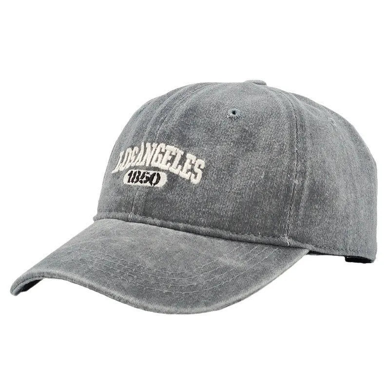 Retro adjustable peaked cap with distressed embroidery in conical crown design