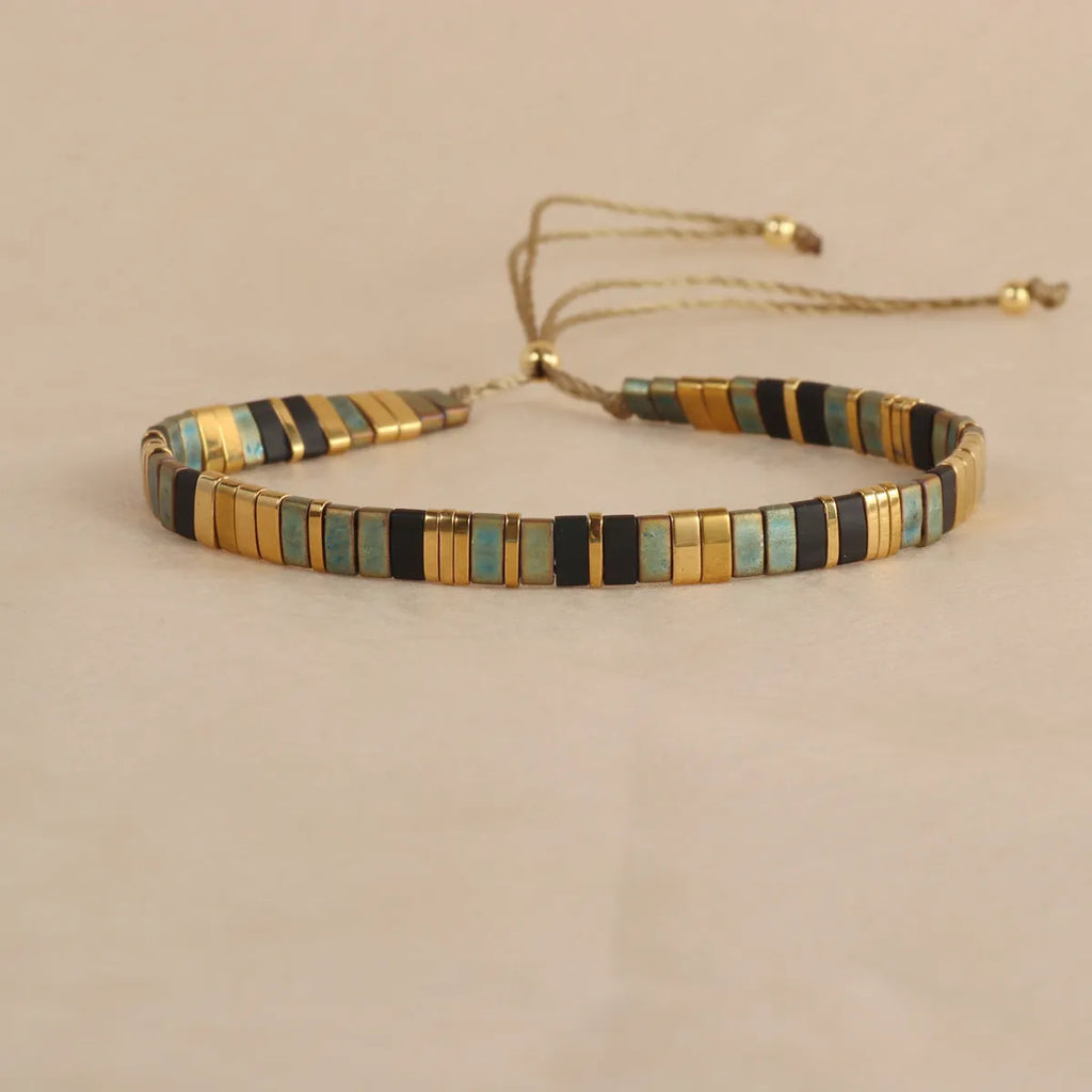 Geometric beaded pull-on bracelet in milky white, black, green, blue, or red colours