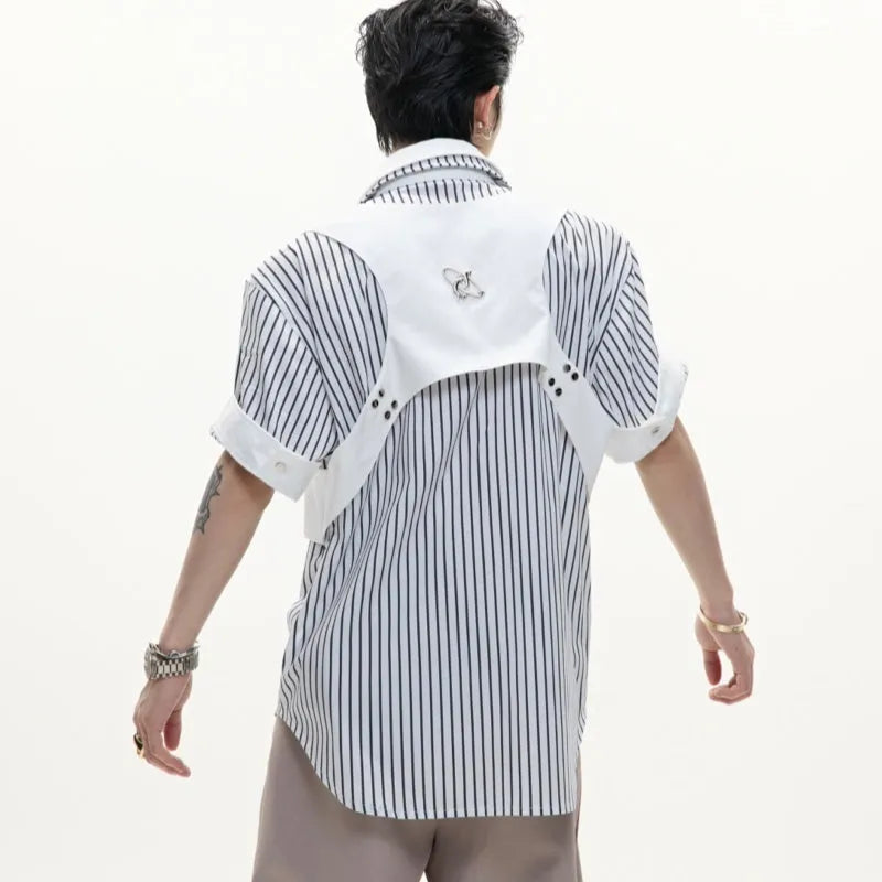 Man wearing a black and white striped cotton shirt with a distinctive double collar and short sleeves.
