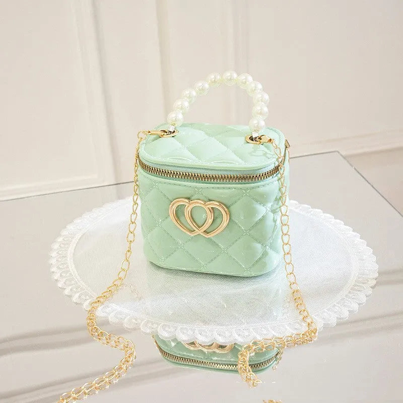 PVC bucket-shaped gel bag with a heart pattern, shown in one of seven available colours.