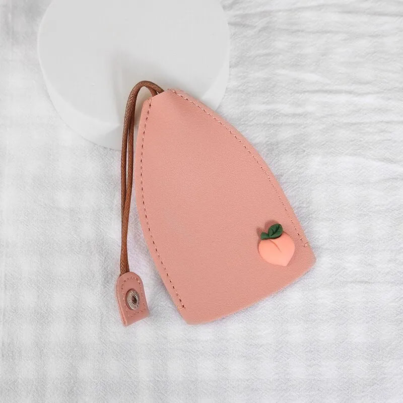 Cartoon pull-out car key case in PU leather with colourful designs measuring 14 x 7.5 cm