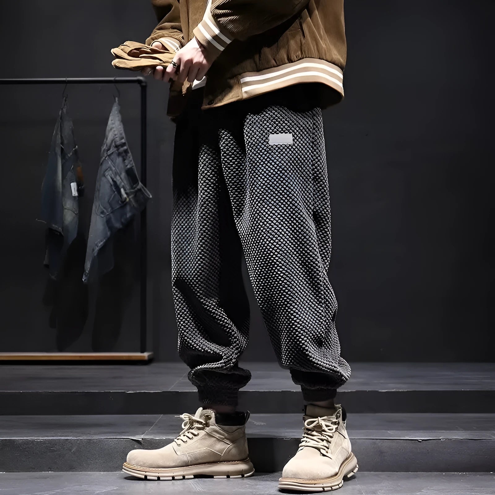 Men's grey ankle-tied casual sweatpants with a light straight leg on a neutral background.