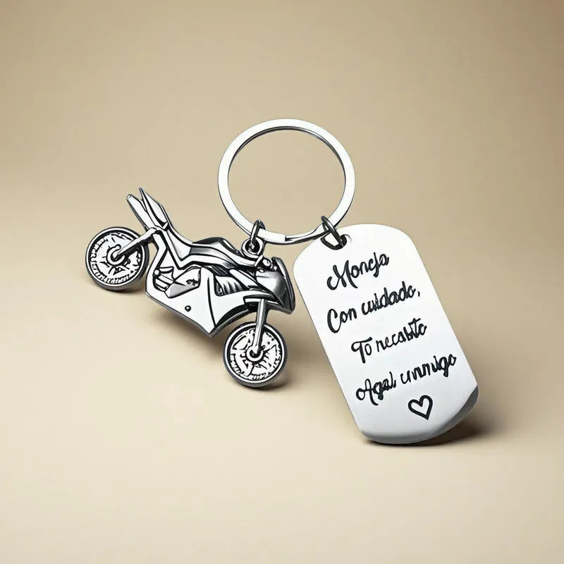 Stainless steel motorcycle keychain on a flannel bag.