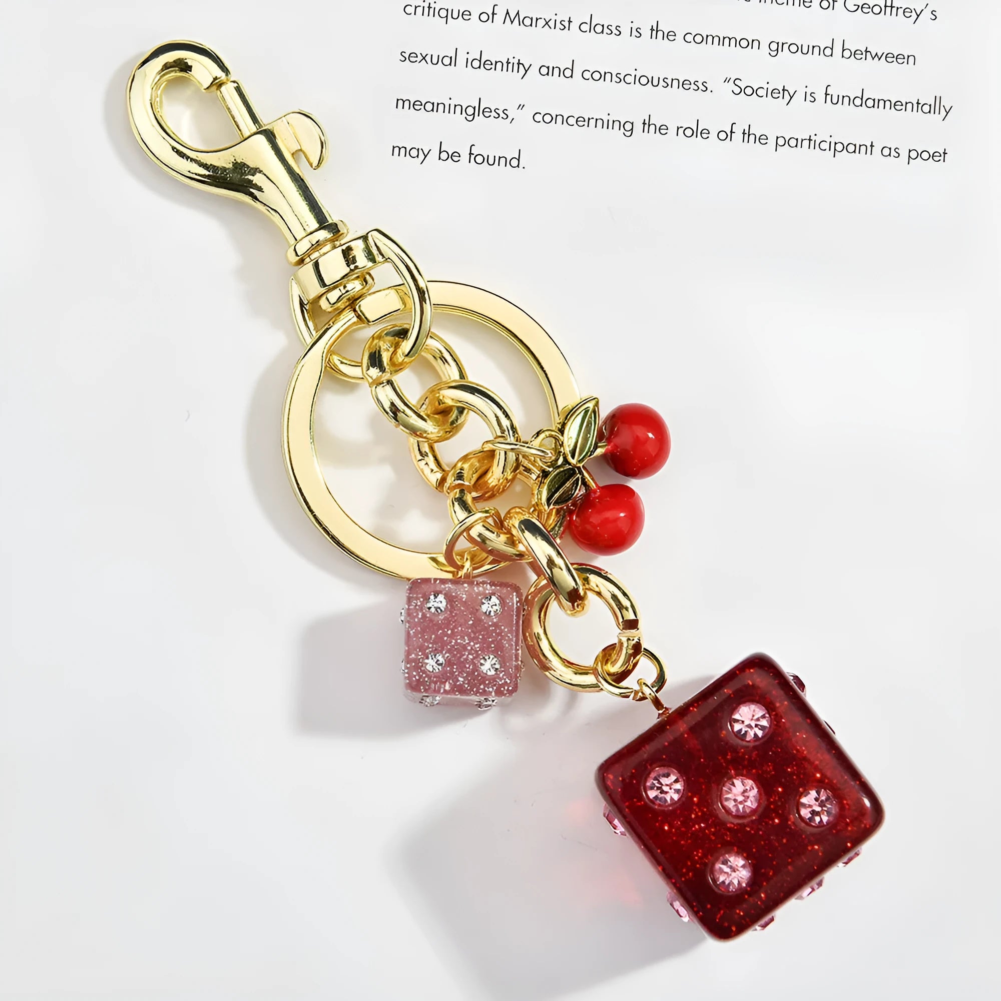 Vintage cherry two-tone dice design on a square electroplated metal keychain pendant.